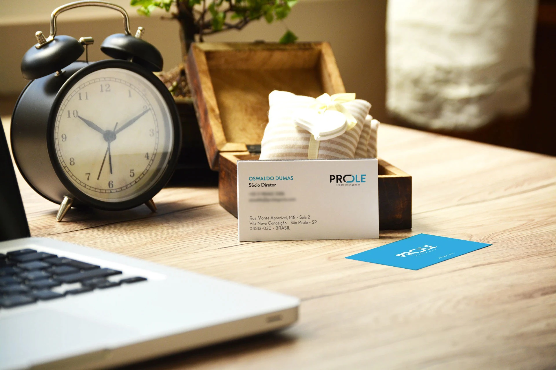 Prole Sports business cards displayed on a desk.